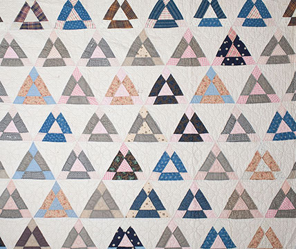 Multi-Generational Cotton Triangle Quilt; c. 1870s-1930s; Gift of Cornetts