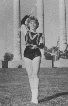 1964 Patty Grahm Kespohl as Feature Twirler for Marching Mizzou. Savitar 1965 page 206, University Archives