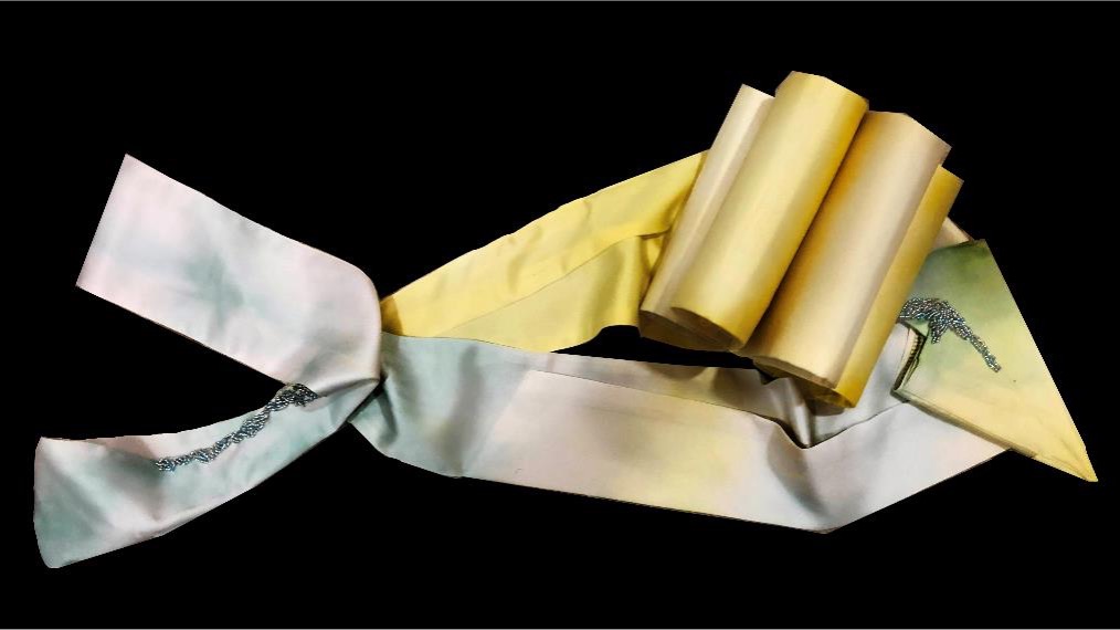 An abstract art piece on a black background featuring pastel-colored, ribbon-like shapes with soft yellows and blues, evoking a calm, serene mood.